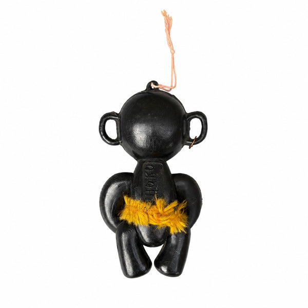 Ancien personnage publicitaire Mi-Cho-Ko La Pie qui Chante en plastique noir avec jupe en fibres jaunes – Années 1960-1970