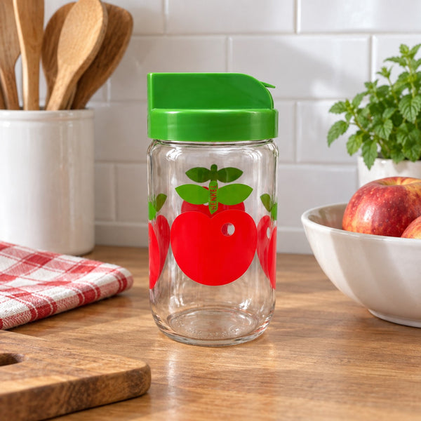 Ancien pot de cuisine Henkel en verre à décor de pommes, couvercle vert à clapet