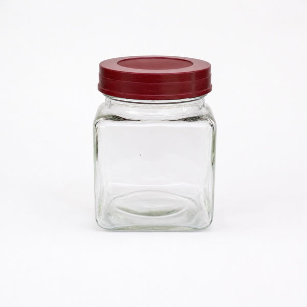 Ancien petit bocal d'épicerie en verre avec couvercle bordeaux en bakélite