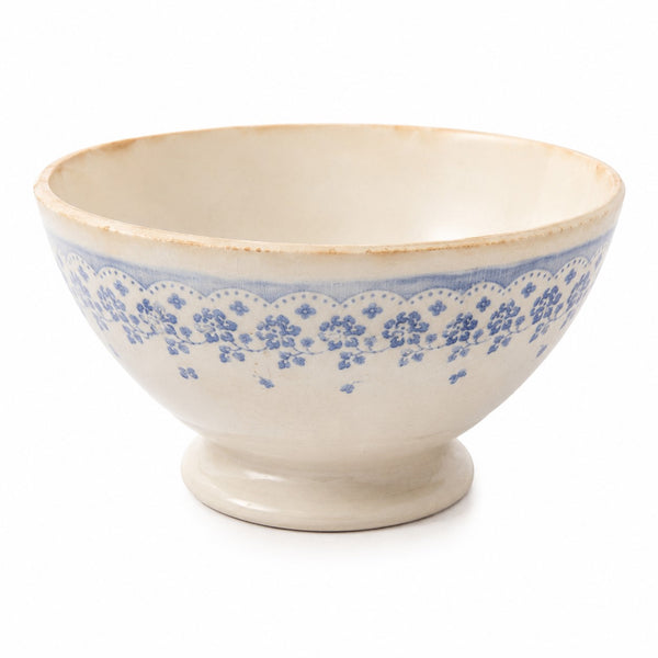 Bol ancien en faïence blanc cassé à décor floral bleu