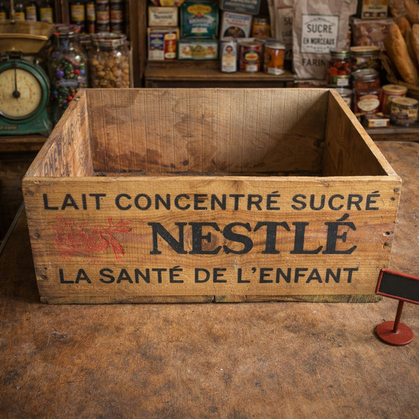 Caisse en bois ancienne Nestlé – Lait concentré sucré (fin XIXe – début XXe siècle)