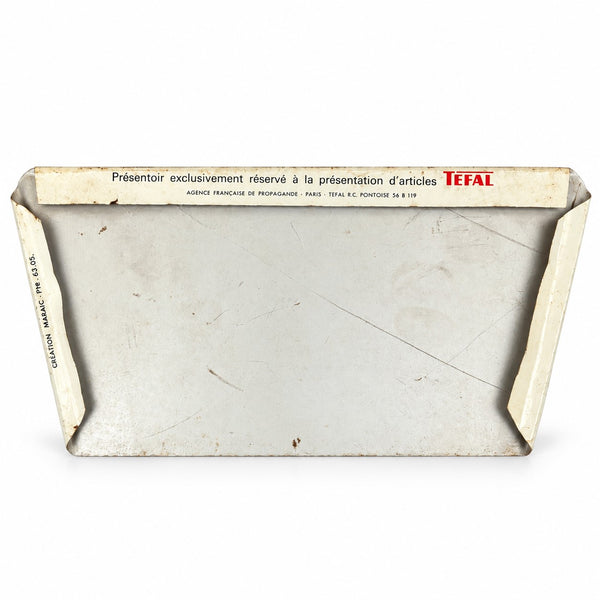 Plaque de présentoir publicitaire ancienne Tefal en tôle lithographiée « n’attache jamais ! »