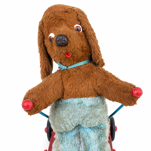 Jouet ancien à tirer animé – chien en peluche sur tricycle à skis