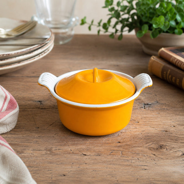 Mini cocotte ancienne en fonte émaillée orange et blanche – diamètre 14 cm