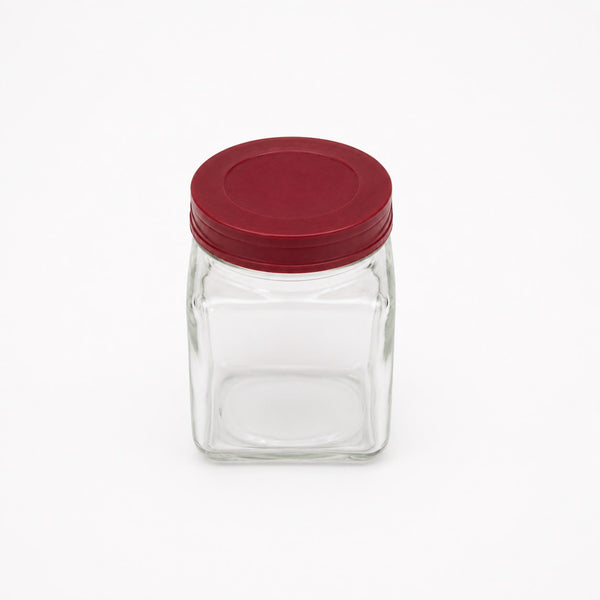 Ancien petit bocal d'épicerie en verre avec couvercle bordeaux en bakélite