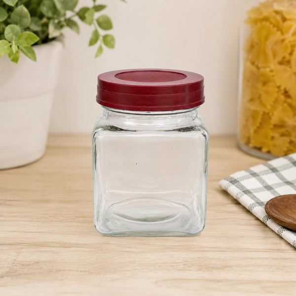 Ancien petit bocal d'épicerie en verre avec couvercle bordeaux en bakélite