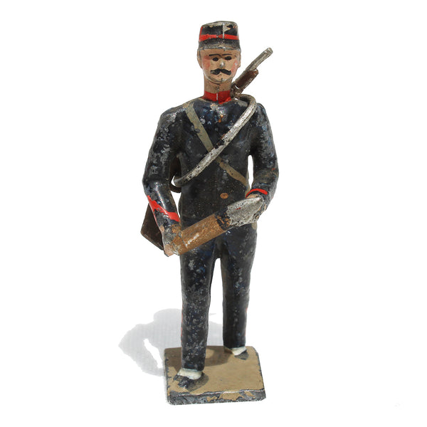 Ancienne figurine en plomb plein CBG Mignot soldat français / Servant Artilleur de campagne avec un obus