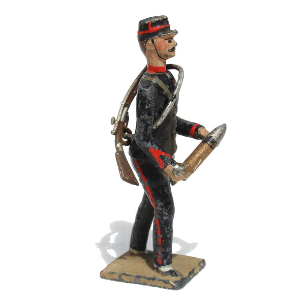 Ancienne figurine en plomb plein CBG Mignot soldat français / Servant Artilleur de campagne avec un obus