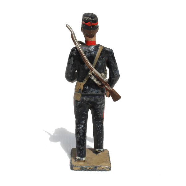 Ancienne figurine en plomb plein CBG Mignot soldat français / Servant Artilleur de campagne avec un obus