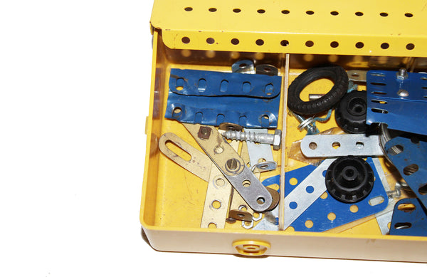 Boîte de rangement modulable jaune jeu Meccano avec diverses pièces