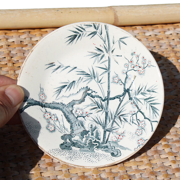 Ancienne tasse à café + soucoupe en faïence de Creil et Montereau / fleurs de pommier / bambou