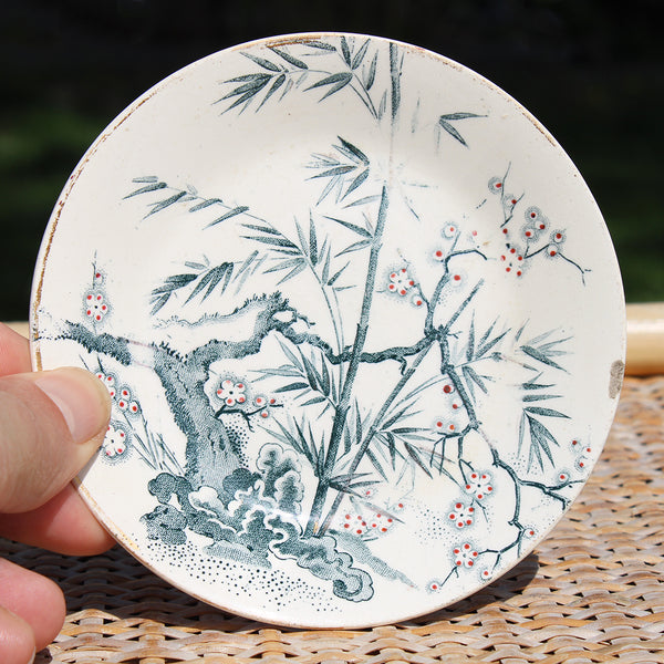 Ancienne tasse à café + soucoupe en faïence de Creil et Montereau / fleurs de pommier / bambou