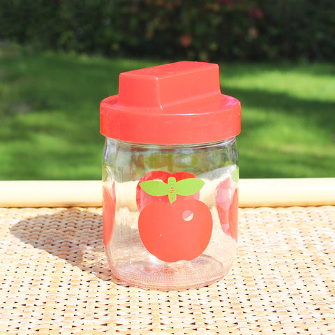 Petit pot vintage Henkel en verre décor pomme bouchon rouge 450 ml