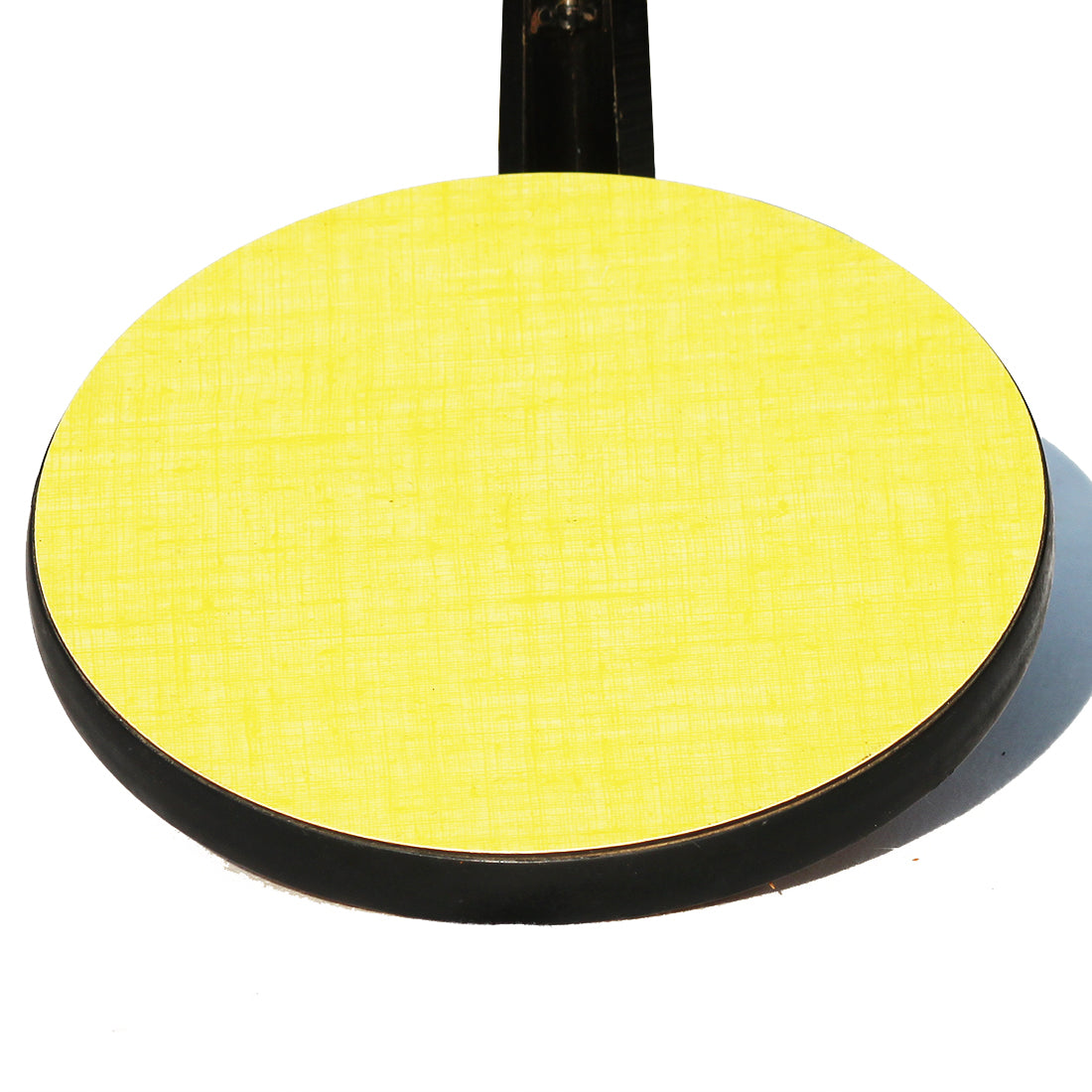 Dessous de plat vintage rond en formica jaune