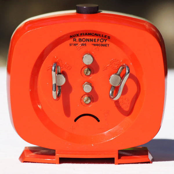 Réveil mécanique vintage Bayard en plastique orange & crème