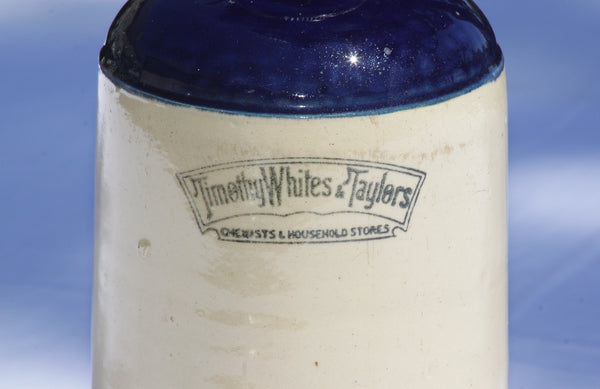Ancienne bouteille en grès bouillotte Timothy Whites & Taylors