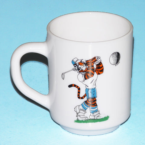 Vintage ESSO advertising mug in Arcopal tiger golfer decor