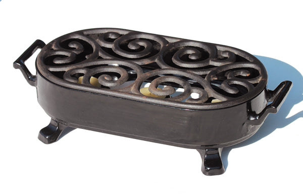 Chauffe plat vintage Staub en fonte émaillée noire à bougie