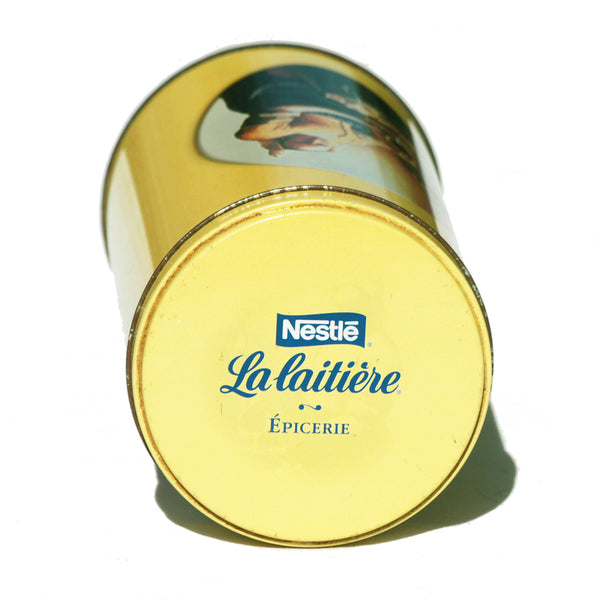 Boîte publicitaire Nestlé La Laitière vide en tôle lithographiée modèle épicerie