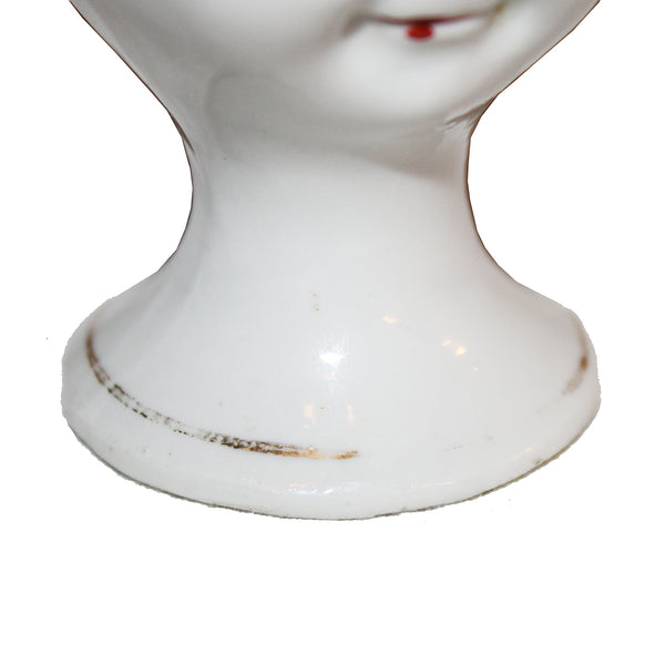 Ancien coquetier en porcelaine tête de garçon style Goebel